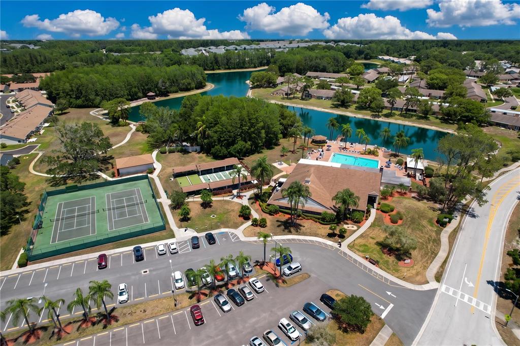 9319 Trowbridge Court New Port Richey, FL 34655 - Photo 6 of 78 an aerial view of a house with a garden and lake view
