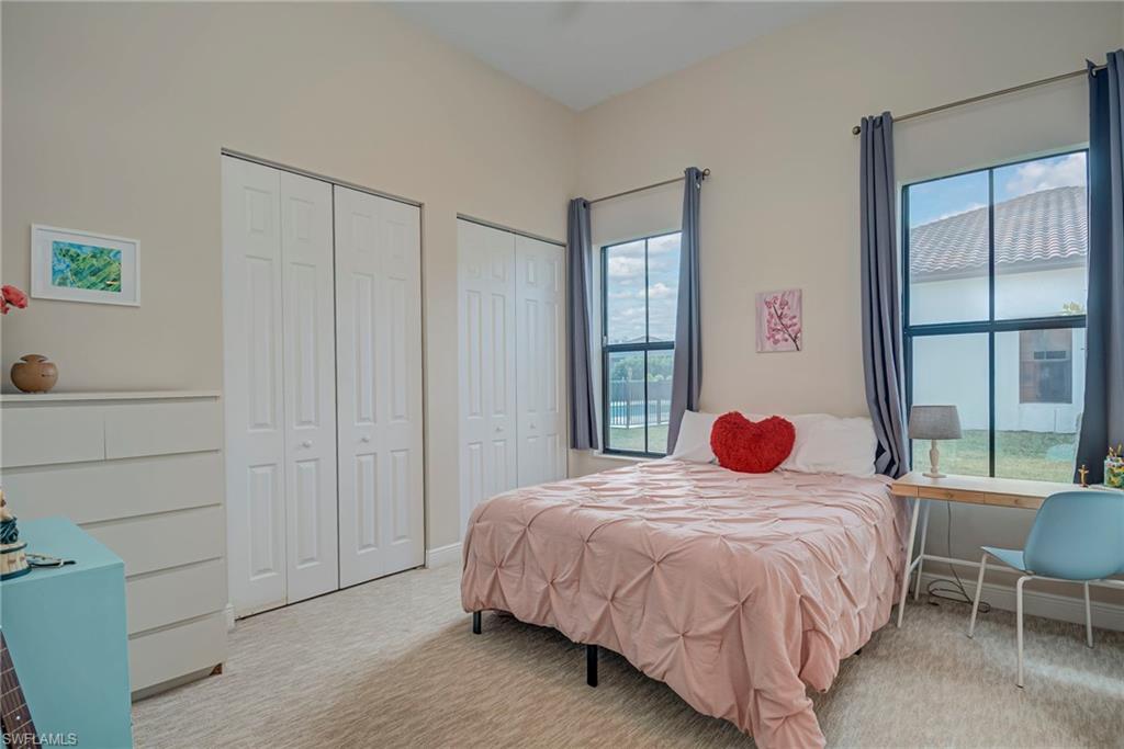 5344 Allen Place Ave Maria, FL 34142 - Photo 15 of 43 Bedroom #2 with multiple closets and light colored carpet