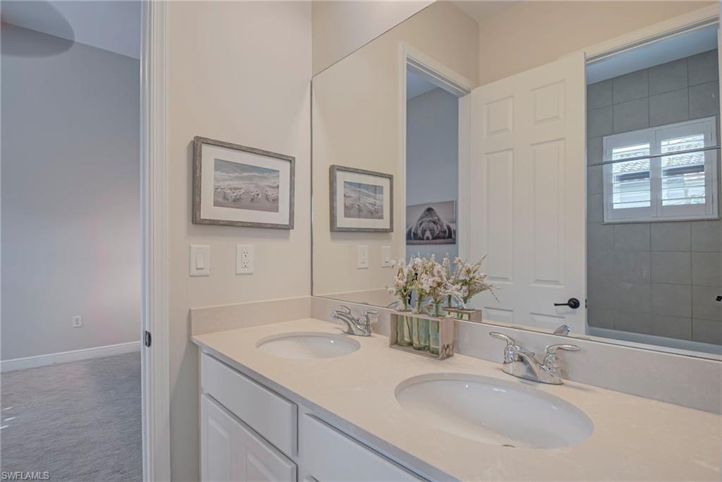 5344 Allen Place Ave Maria, FL 34142 - Photo 17 of 43 Jack N Jill Bathroom with double vanity and carpet
