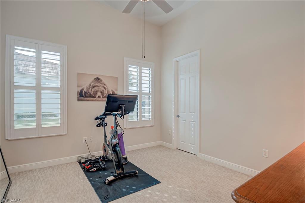 5344 Allen Place Ave Maria, FL 34142 - Photo 18 of 43 Bedroom #3 with light colored carpet, ceiling fan, and a high ceiling