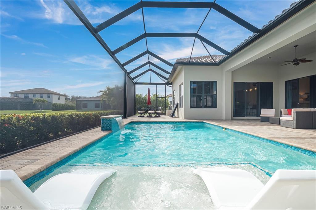 5344 Allen Place Ave Maria, FL 34142 - Photo 33 of 43 Pool waterfall, covered and uncovered areas
