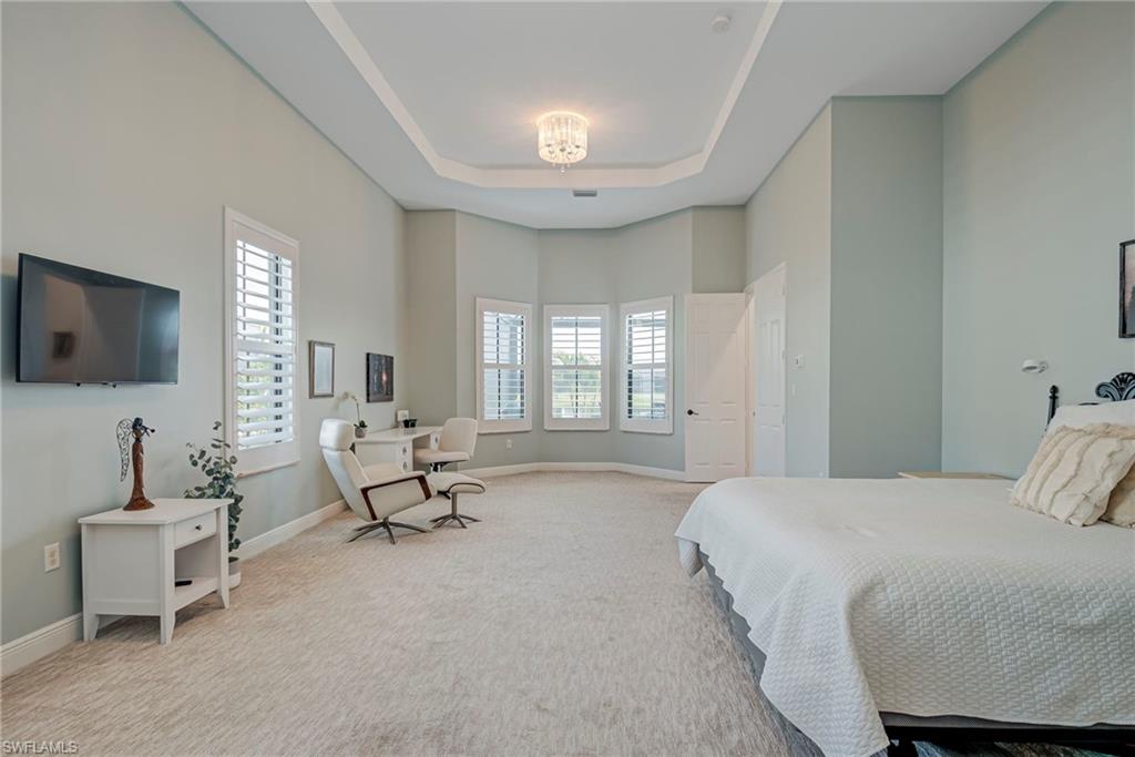 5344 Allen Place Ave Maria, FL 34142 - Photo 4 of 43 Primary Bedroom with carpet and a tray ceiling