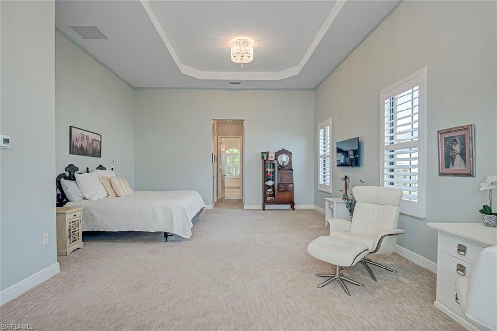 5344 Allen Place Ave Maria, FL 34142 - Photo 5 of 43 Primary Bedroom with a tray ceiling and light colored carpet
