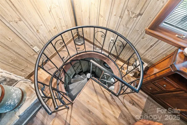 a view of a balcony with wooden floor