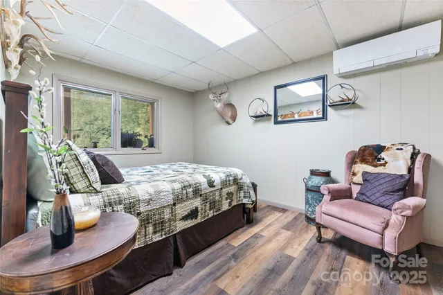 a bed sitting in a bedroom next to a window