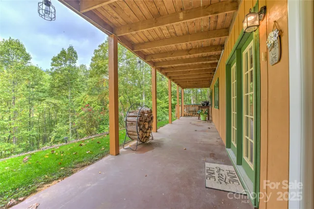 a view of a porch with chairs and a roof