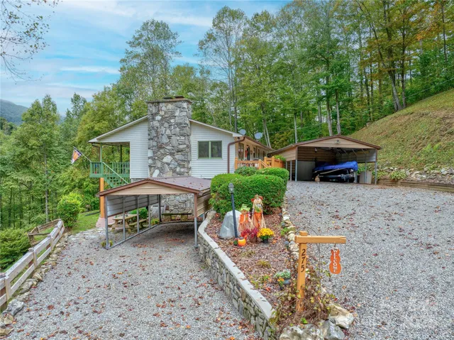 aerial view of a house with backyard and sitting area