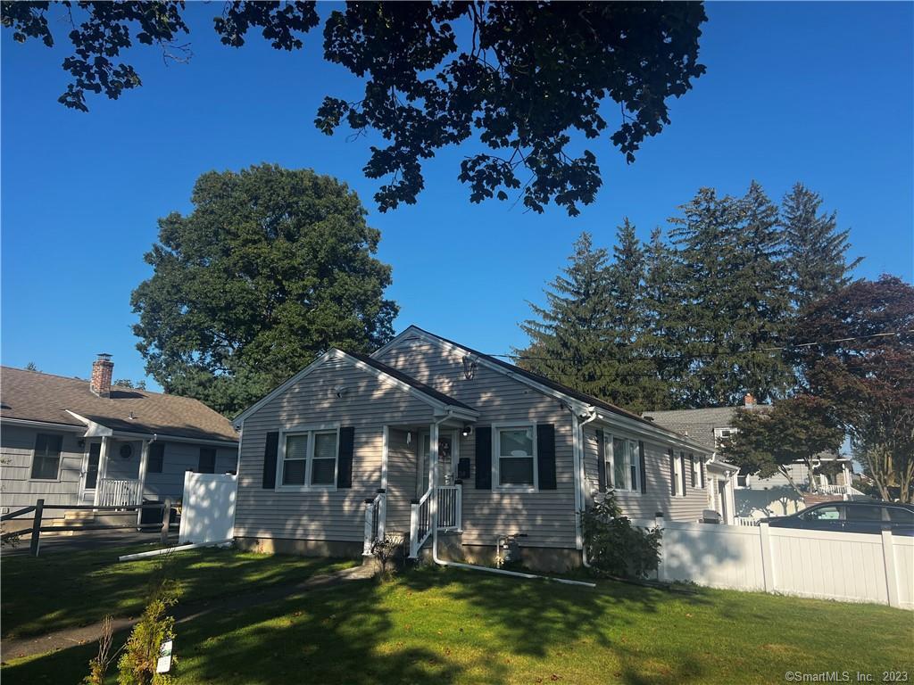 710 Huntington Road Stratford, CT 06614 - Photo 1 of 1 a front view of a house with garden