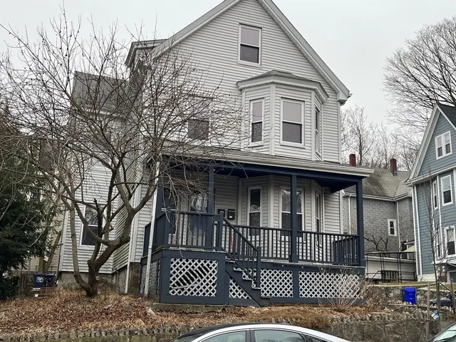 a view of a house with a iron gate
