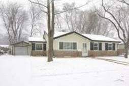 950 Coach Road Homewood, IL 60430 - Photo 1 of 1 a front view of a house with a yard covered in snow