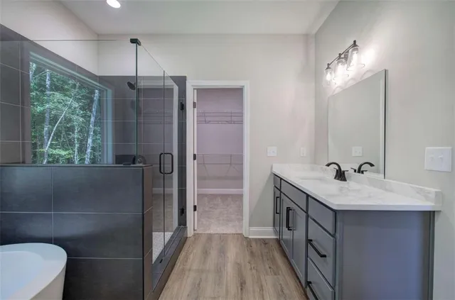 a bathroom with a sink a toilet a mirror and window