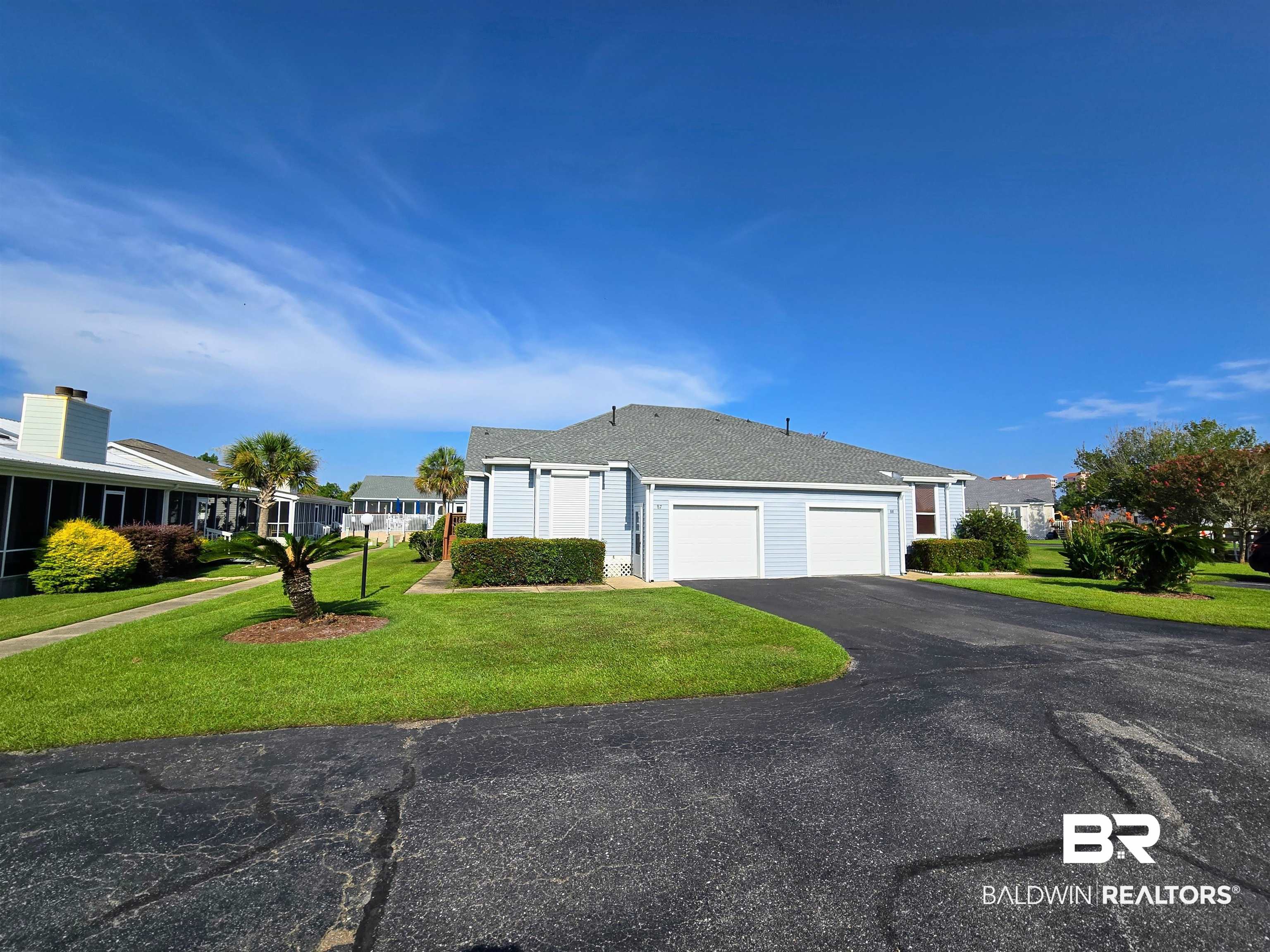 3200 Loop Road, Unit 87 Orange Beach, AL 36561 - Photo 1 of 46 Single story home featuring a garage and a front yard