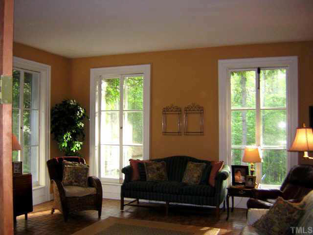 2800 Hawk Hill Road Mebane, NC 27302 - Photo 6 of 10 Living room featuring ceiling to floor windows.