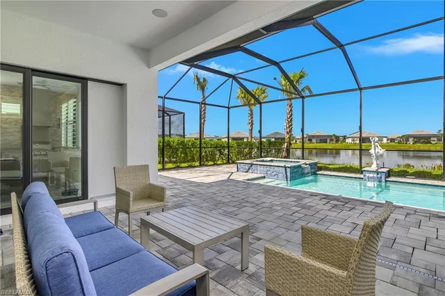 a patio with a table and chairs
