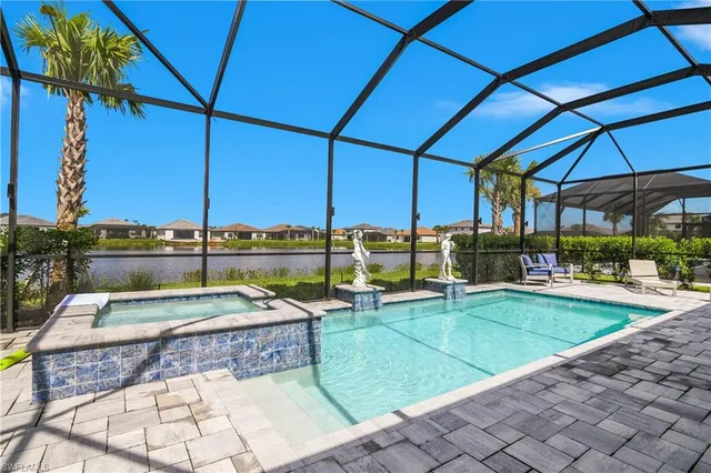 a view of a swimming pool with a patio