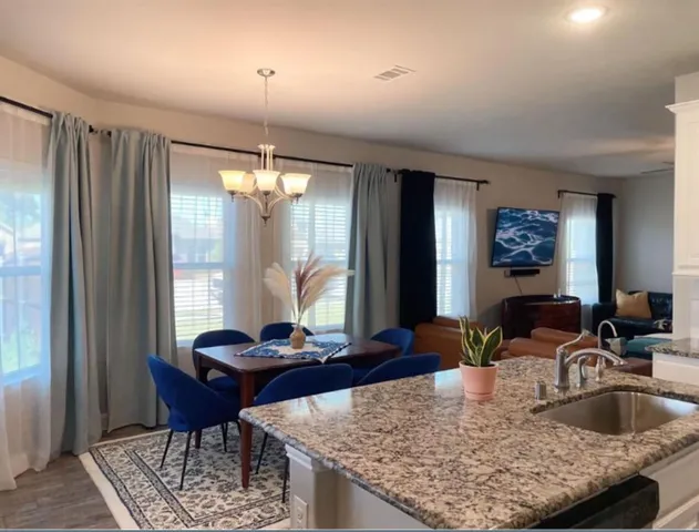 a kitchen with a table and chairs in it