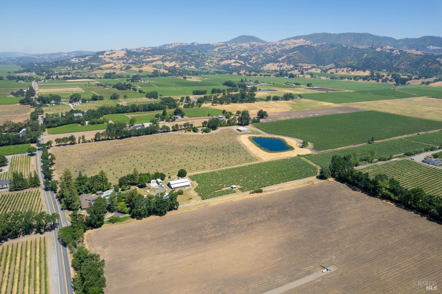 5744 Highway 128 Geyserville, CA 95441 - Photo 4 of 13 an aerial view of a house with a garden and mountains view