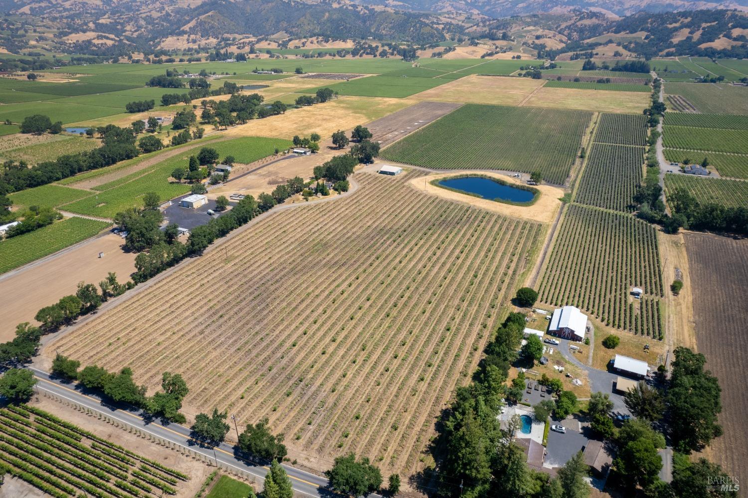 5744 Highway 128 Geyserville, CA 95441 - Photo 5 of 13 an aerial view of a house with a lake view