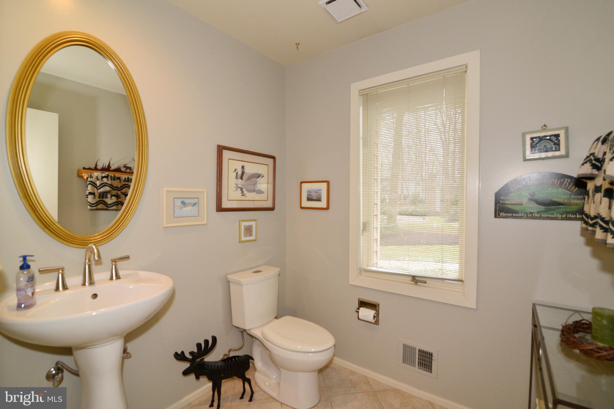 11410 Fieldstone Lane Reston, VA 20191 - Photo 30 of 50 a bathroom with a toilet sink and mirror
