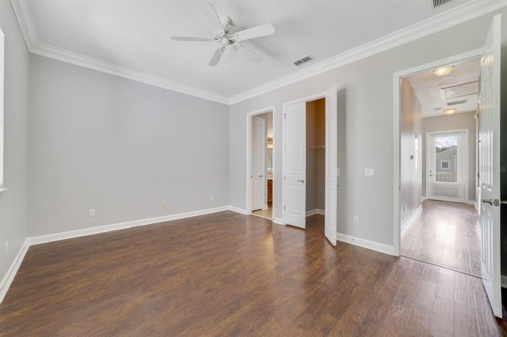 1426 Fairview Circle Reunion, FL 34747 - Photo 25 of 35 a view of an empty room with wooden floor