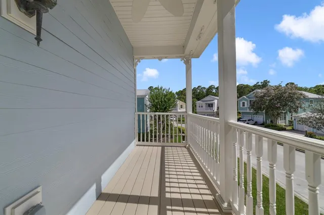 a view of a balcony with wooden floor
