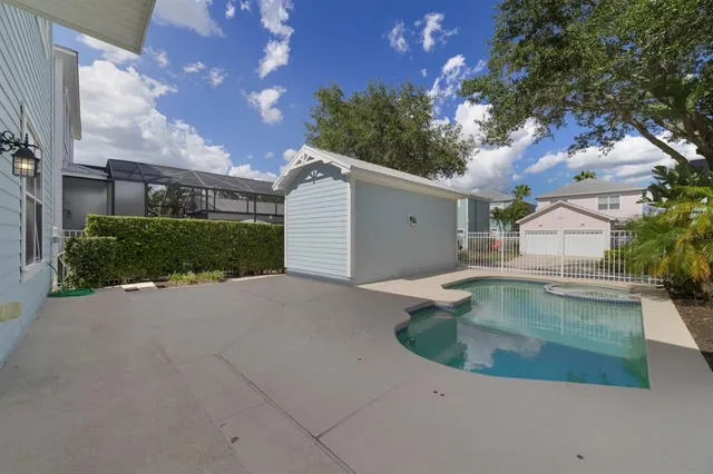 a view of a house with a backyard
