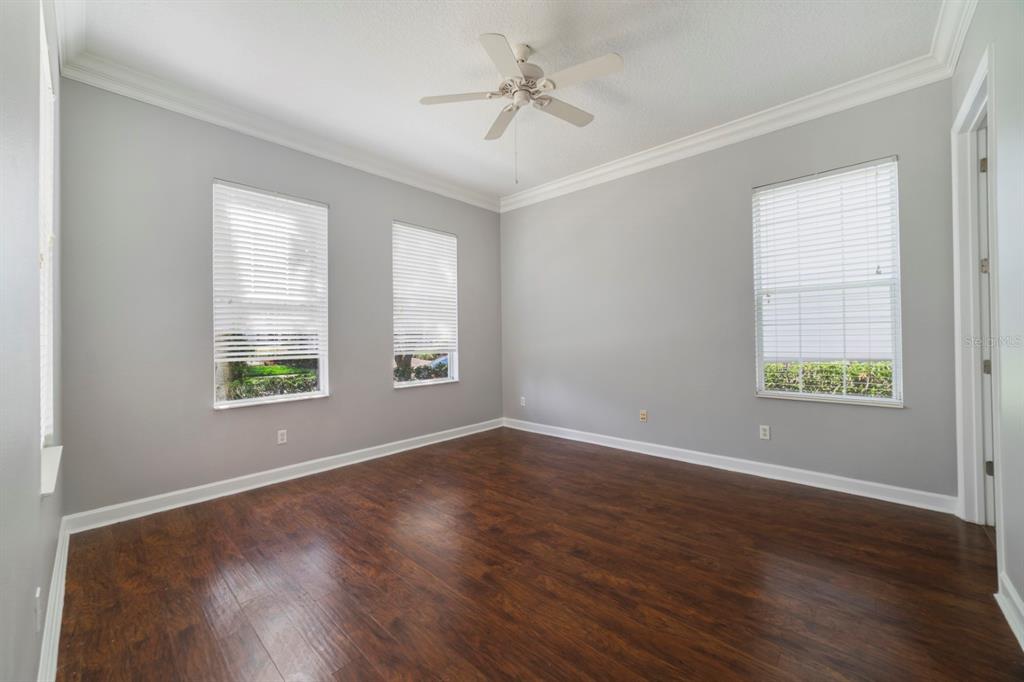1426 Fairview Circle Reunion, FL 34747 - Photo 3 of 35 an empty room with wooden floor and windows