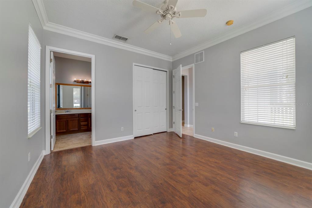 1426 Fairview Circle Reunion, FL 34747 - Photo 4 of 35 an empty room with wooden floor and windows