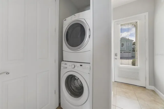 a view of a storage & utility room with dryer and washer