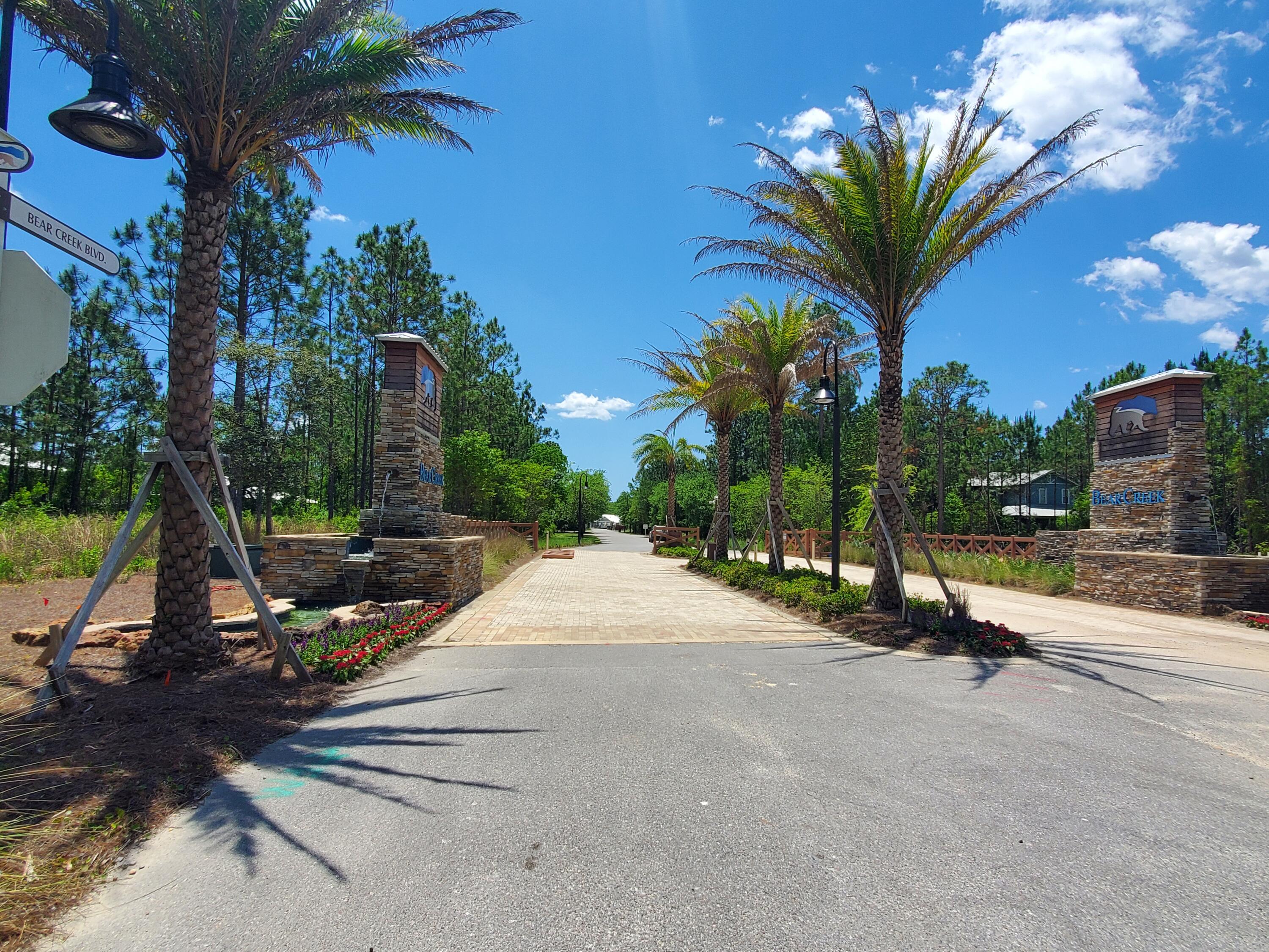 Lot 9 Bear Creek Freeport, FL 32439 - Photo 8 of 9 a view of a park with swings and slides