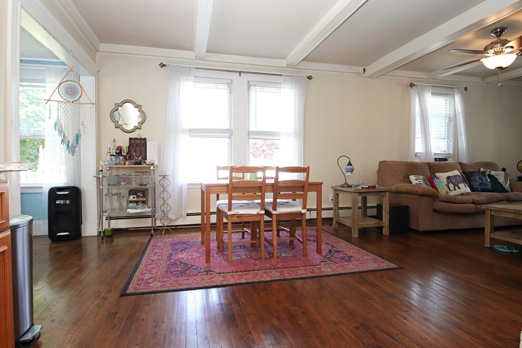 61 Riverbank Road Saugus, MA 01906 - Photo 8 of 42 a view of a dining room with furniture window and wooden floor