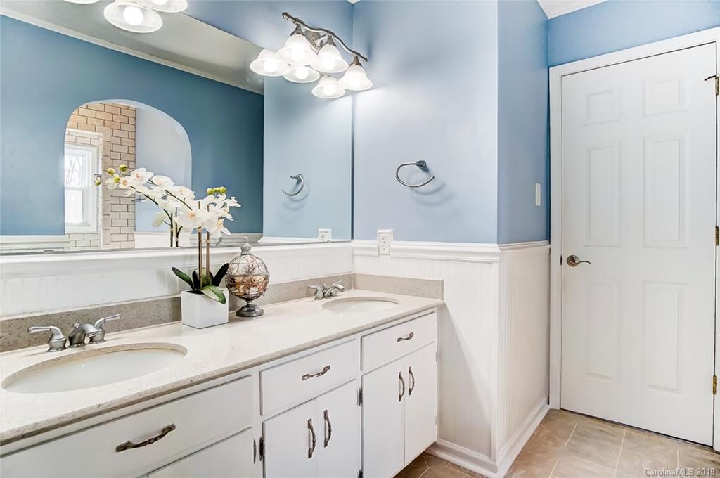 3490 Penshurst Road Rock Hill, SC 29730 - Photo 22 of 35 a bathroom with a double vanity sink and a mirror