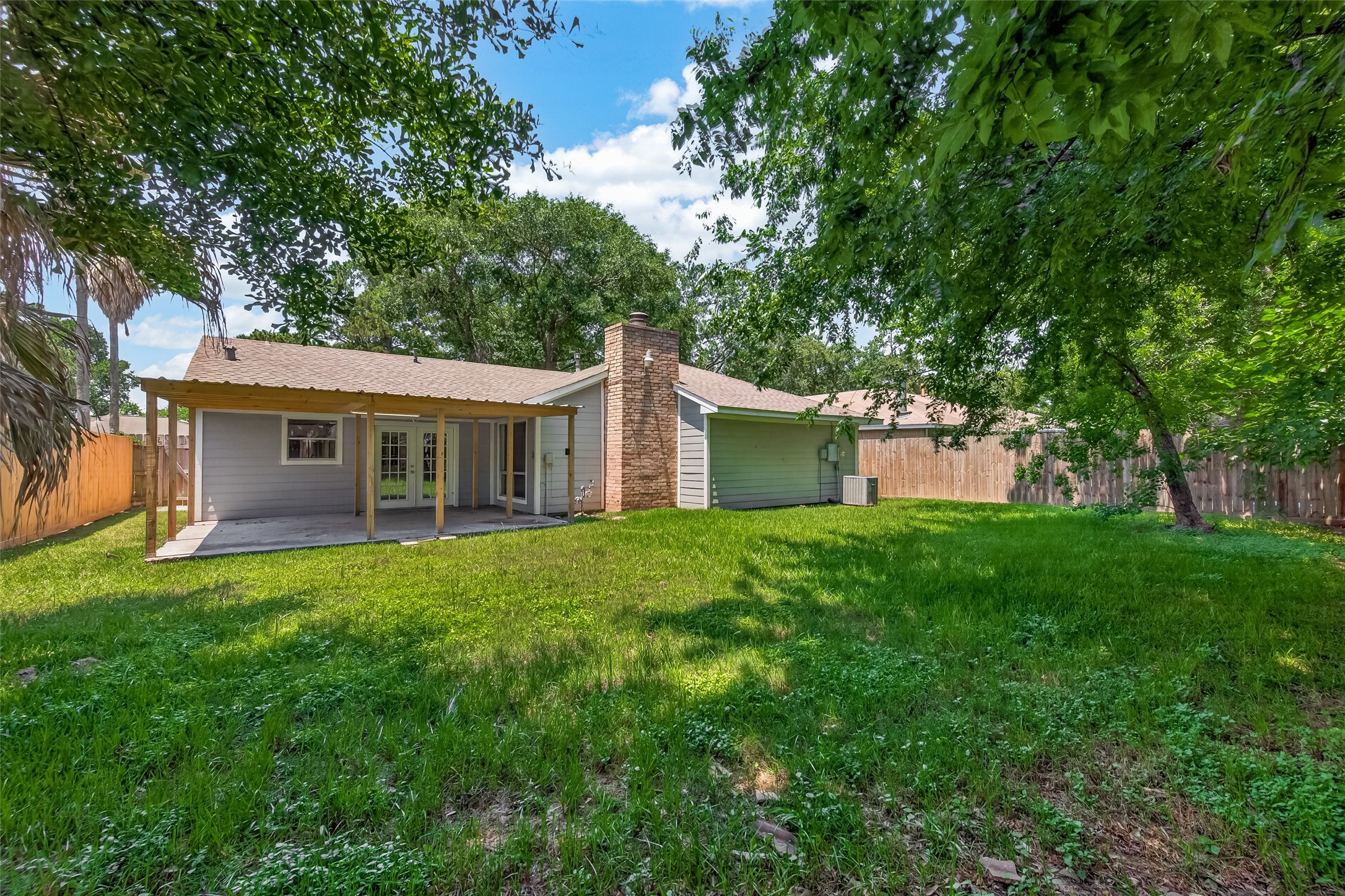 24006 Lone Elm Drive Spring, TX 77373 - Photo 22 of 25 Large well maintained yard with covered patio