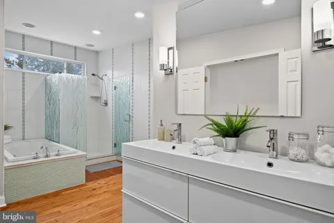 a bathroom with a sink and mirror