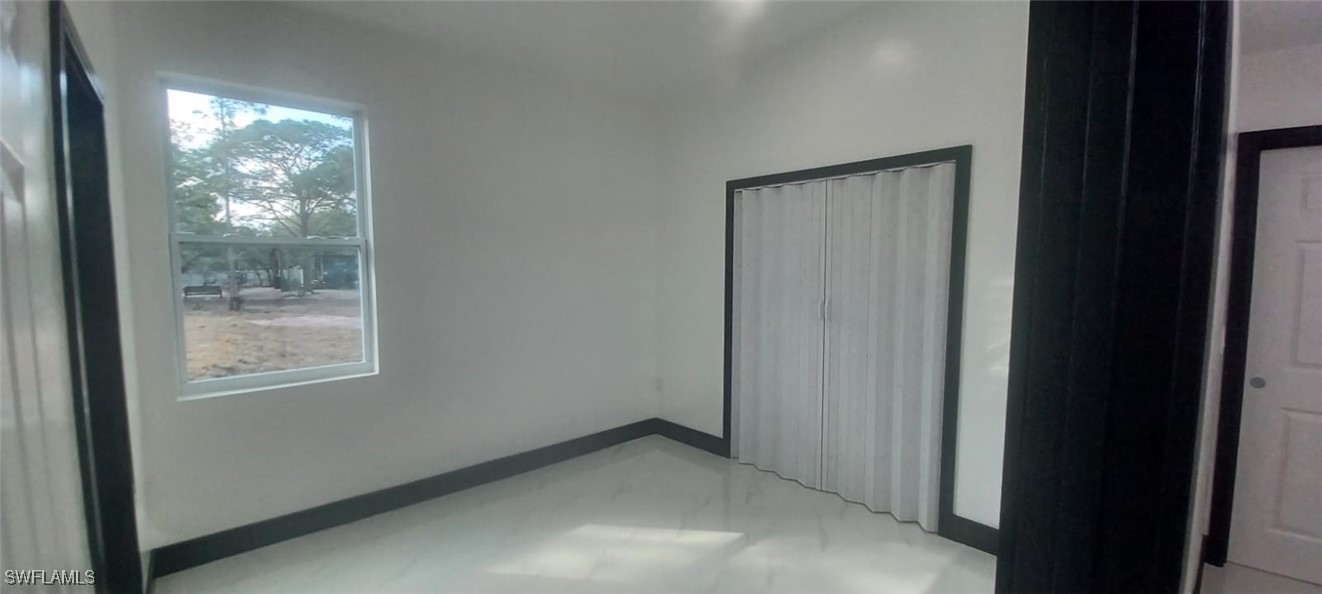 810 South Cabbage Palm Street Clewiston, FL 33440 - Photo 19 of 32 a view of an empty room and window