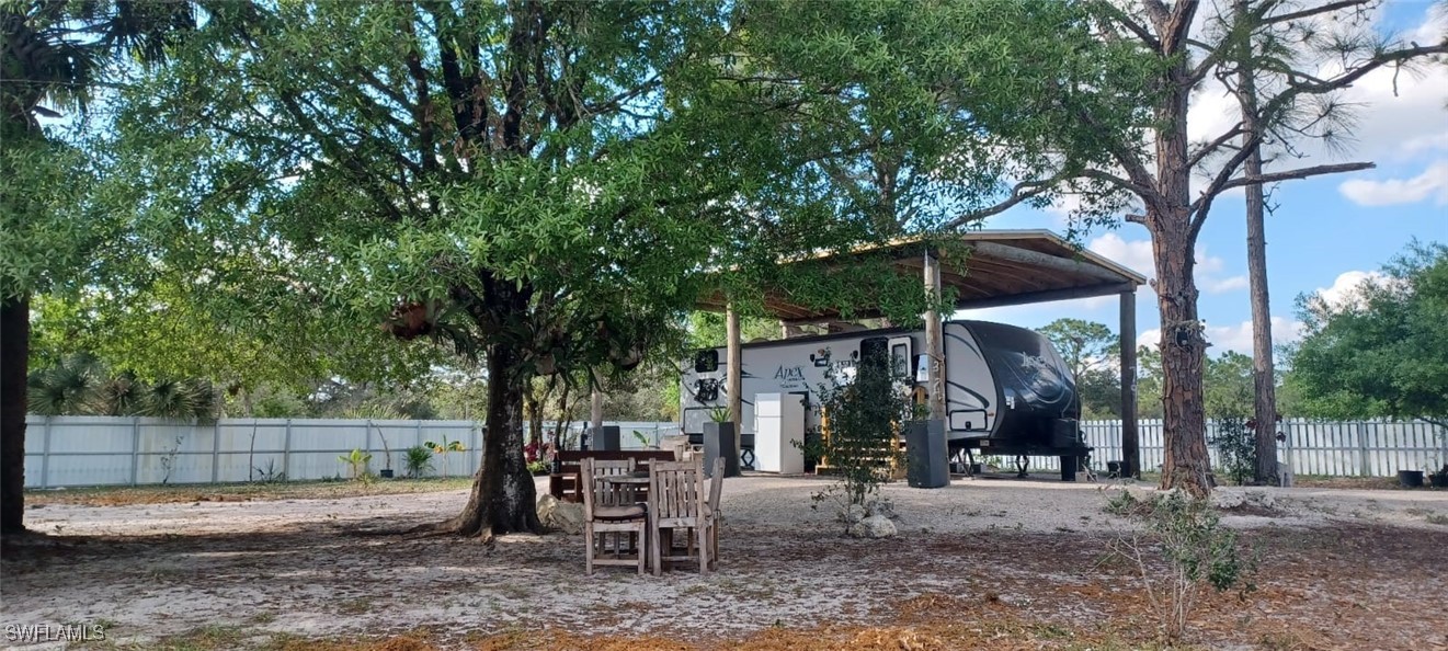 810 South Cabbage Palm Street Clewiston, FL 33440 - Photo 21 of 32 a view of a park that has a tree in it