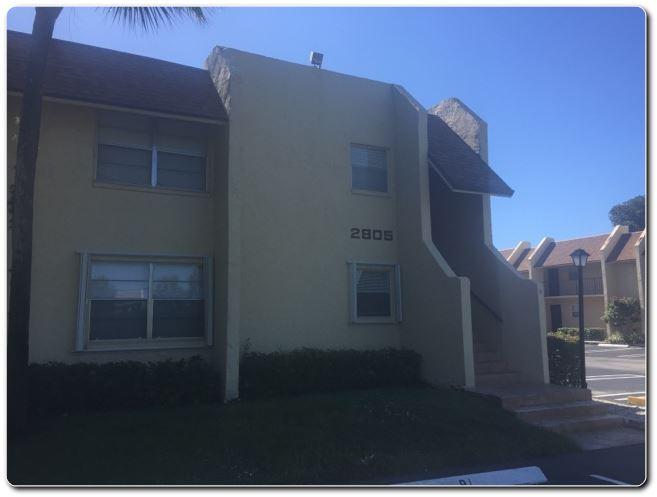 2805 Southwest 22nd Avenue, Unit 2060 Delray Beach, FL 33445 - Photo 1 of 7 a view of a house with a street
