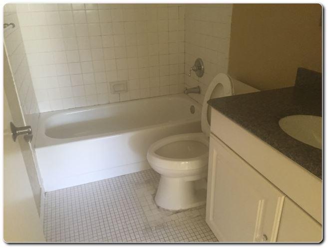 2805 Southwest 22nd Avenue, Unit 2060 Delray Beach, FL 33445 - Photo 7 of 7 a bathroom with a toilet and a shower