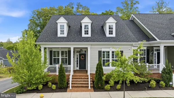 front view of a house with potted plants