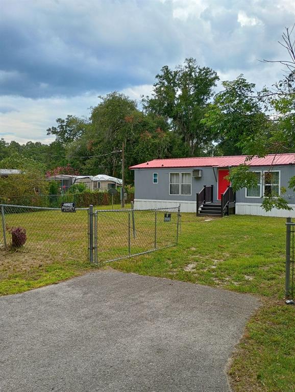a view of an house with a yard