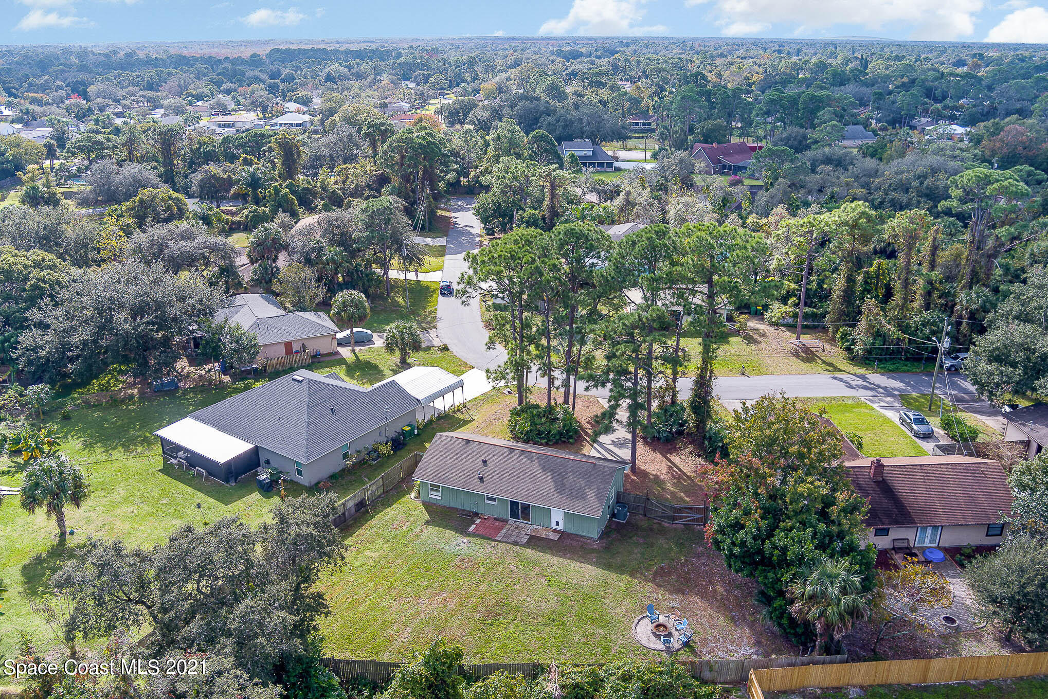 6921 Bentley Road Cocoa, FL 32927 - Photo 18 of 26 an aerial view of a house with a garden