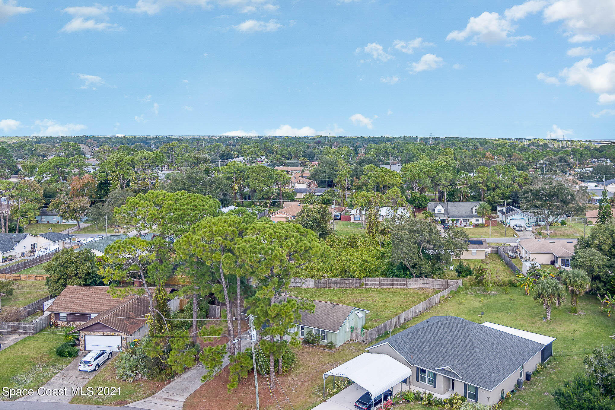 6921 Bentley Road Cocoa, FL 32927 - Photo 3 of 26 an aerial view of residential houses with outdoor space and trees