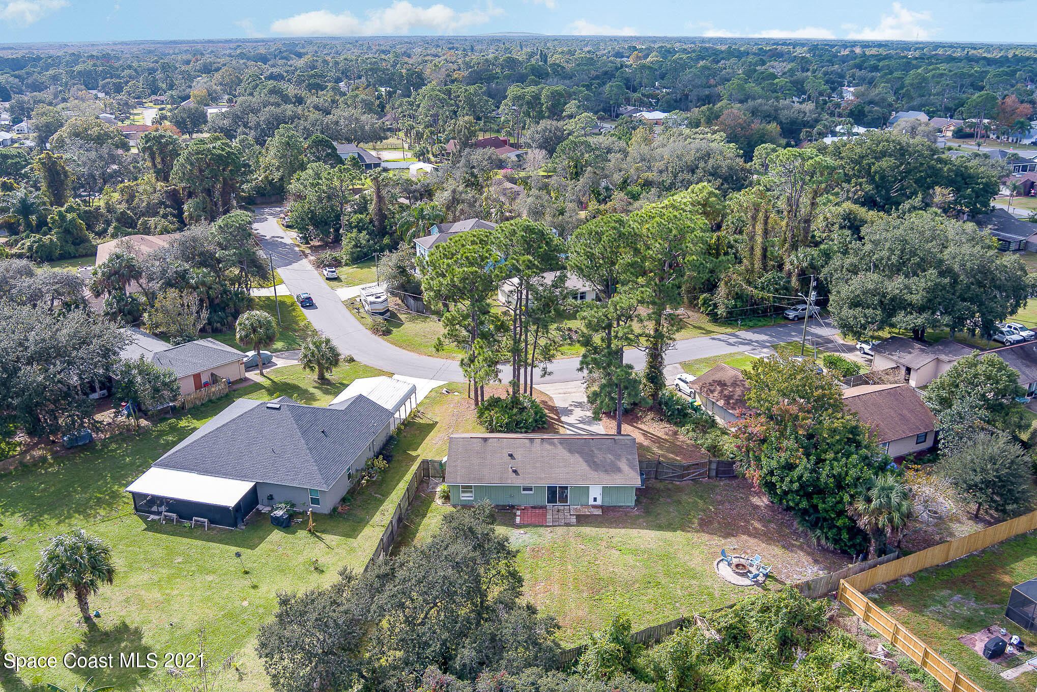 6921 Bentley Road Cocoa, FL 32927 - Photo 25 of 26 an aerial view of house with yard swimming pool and mountain view
