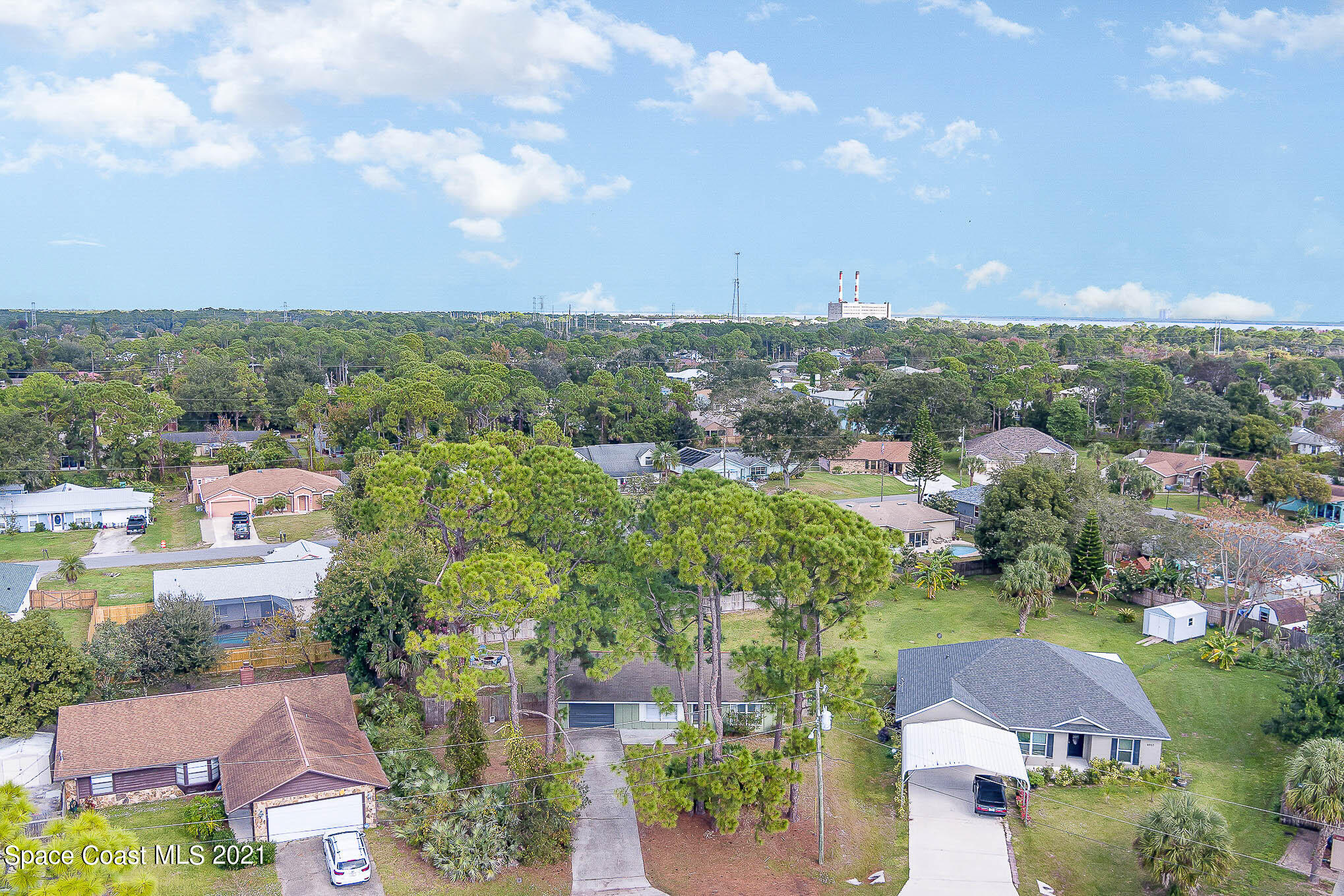 6921 Bentley Road Cocoa, FL 32927 - Photo 4 of 26 an aerial view of a city