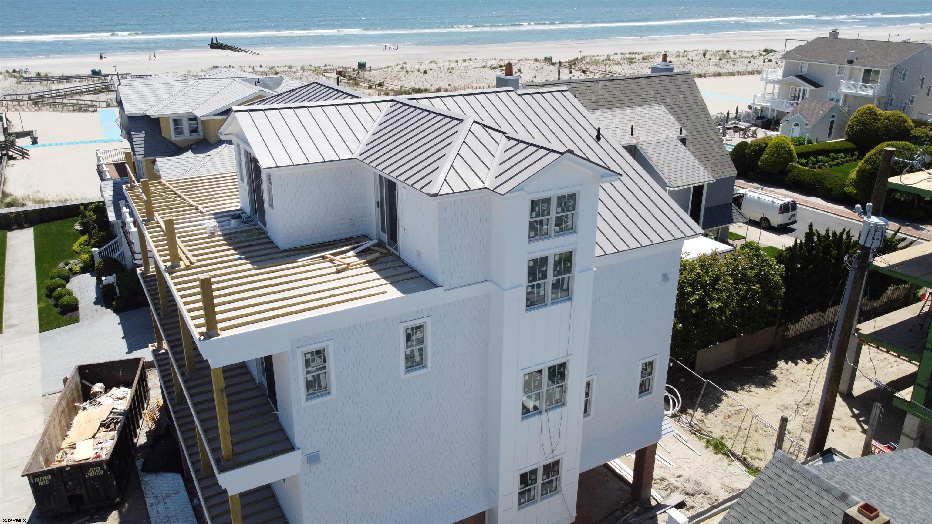 108 South Exeter Avenue Margate City, NJ 08402 - Photo 11 of 42 an aerial view of a house with deck and patio