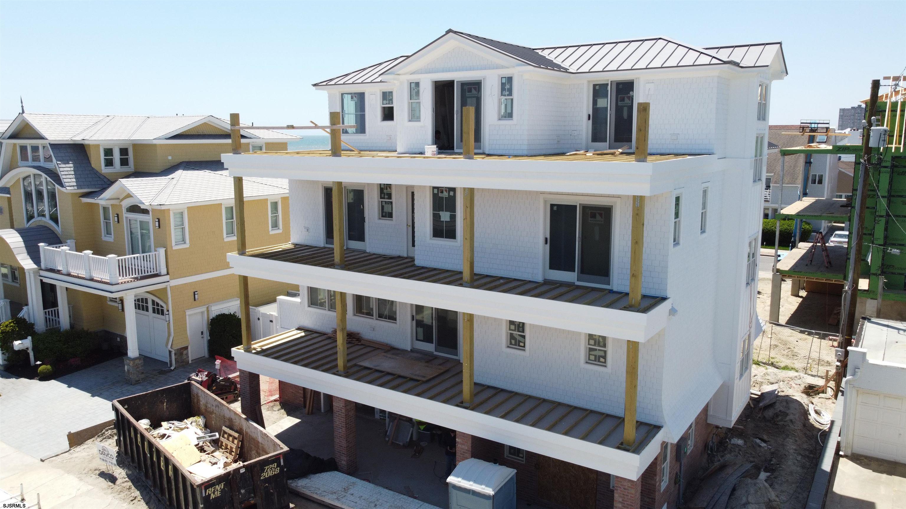 108 South Exeter Avenue Margate City, NJ 08402 - Photo 2 of 42 a view of a big building with many windows