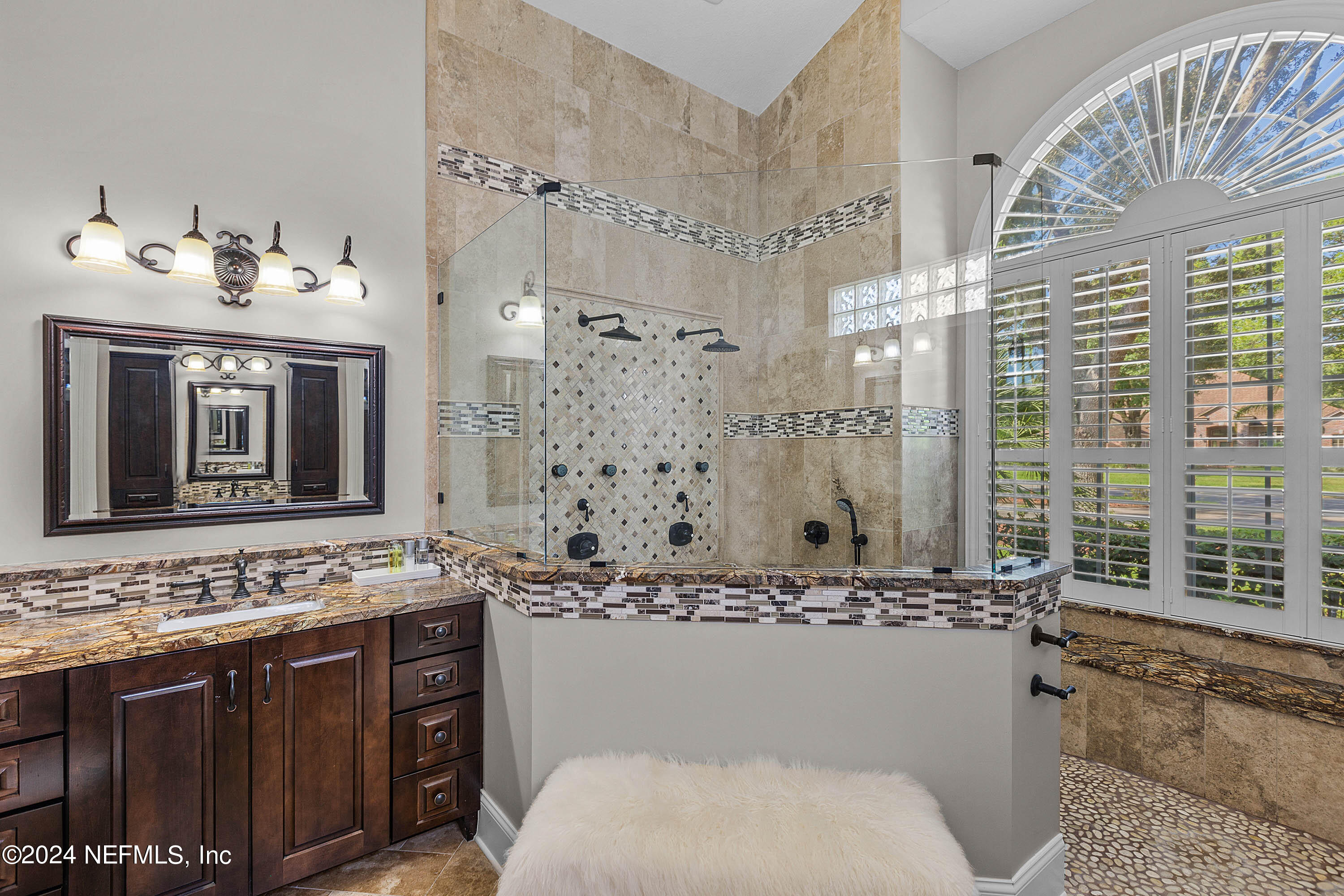 9975 Vineyard Lake Road East Jacksonville, FL 32256 - Photo 14 of 57 a bathroom with a sink and a mirror