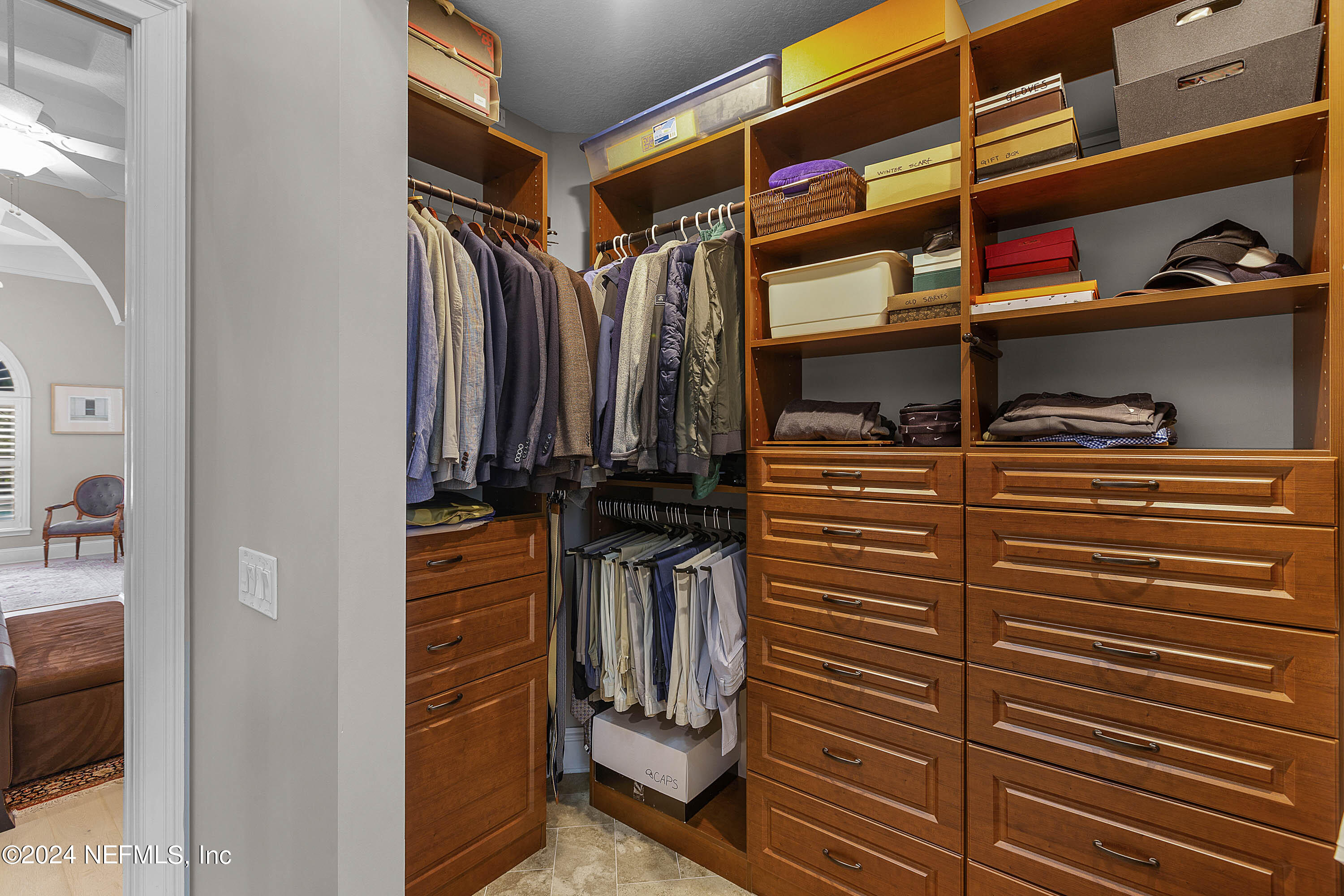 9975 Vineyard Lake Road East Jacksonville, FL 32256 - Photo 16 of 57 a view of walk in closet and clothes