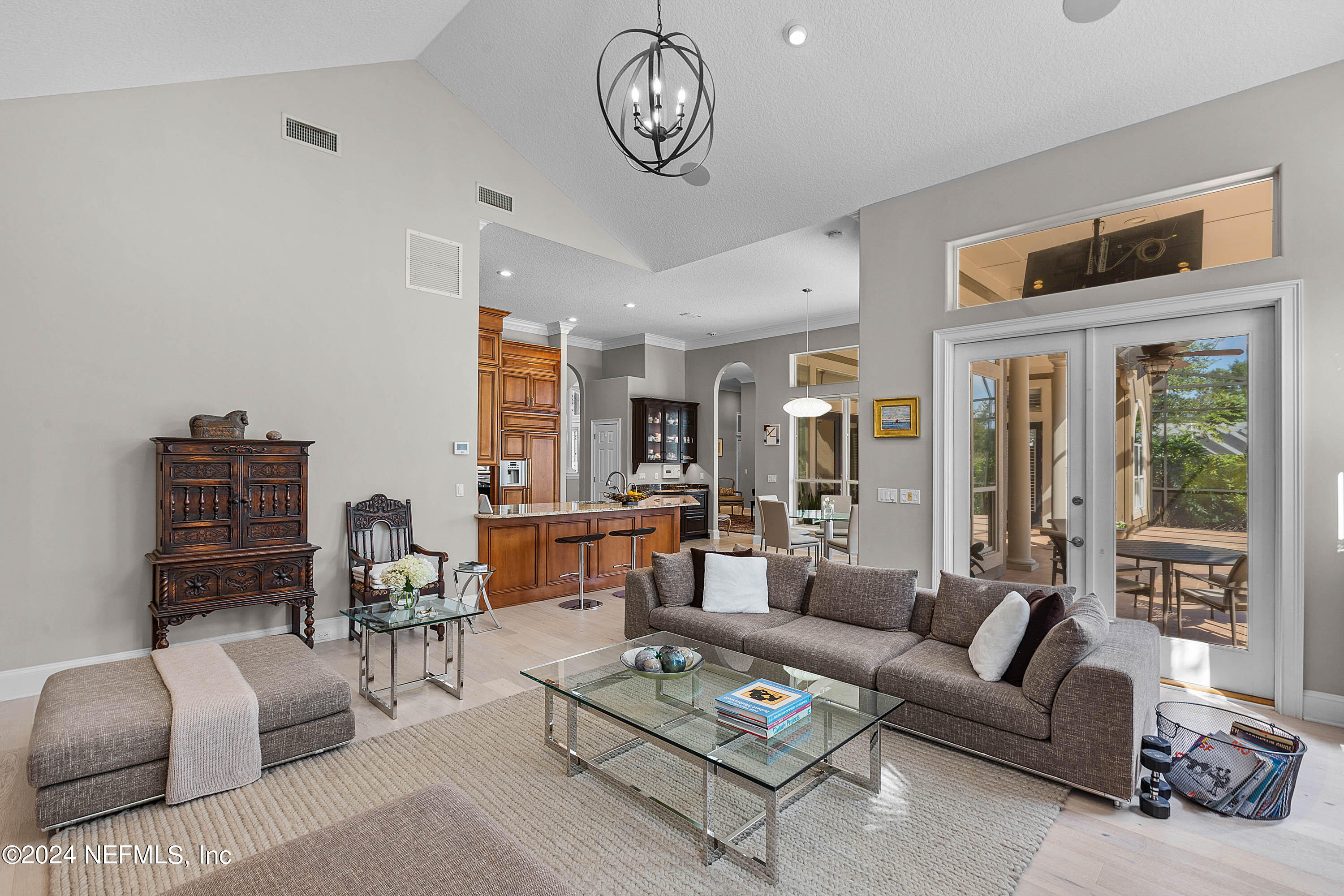 9975 Vineyard Lake Road East Jacksonville, FL 32256 - Photo 25 of 57 a living room with furniture a table and a large window