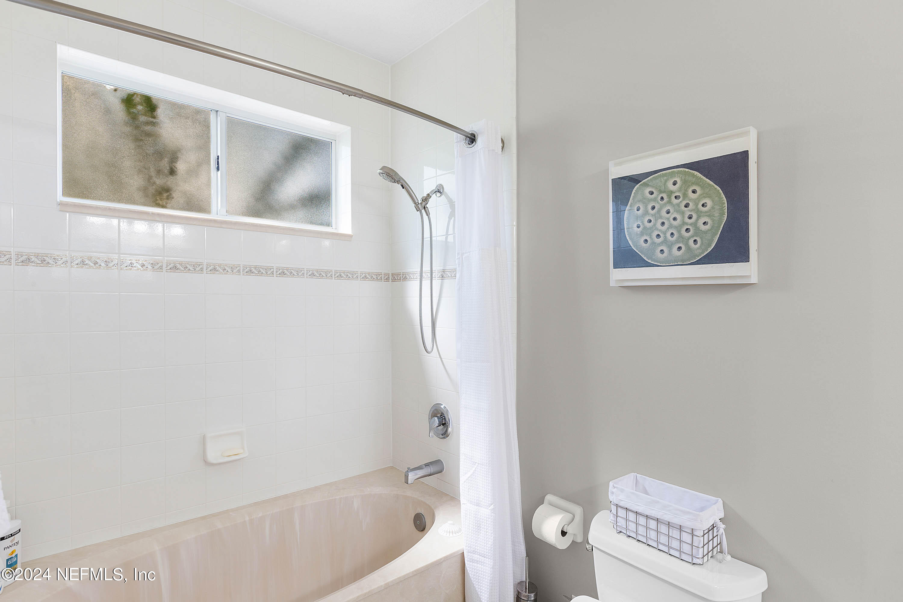 9975 Vineyard Lake Road East Jacksonville, FL 32256 - Photo 32 of 57 a bathroom with a toilet and a shower